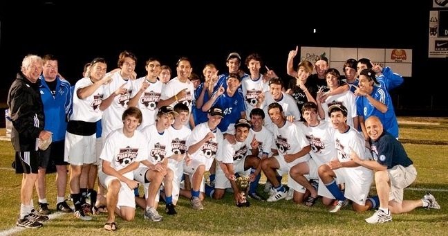 Dr. Cory Plasker with the Walton High School state champions soccer team